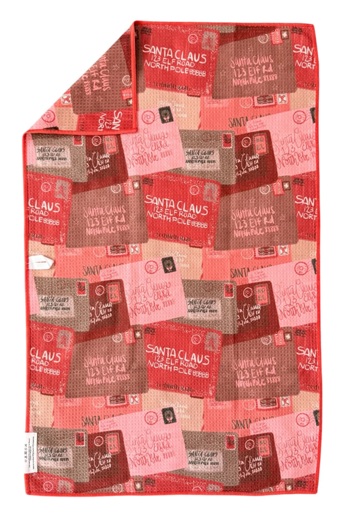 Red and brown patterned hand towel with 'Santa Claus' letters.