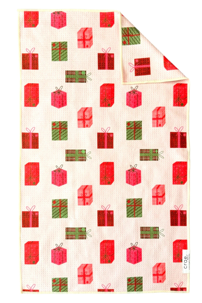 Microfiber hand towel with red and green presents design.
