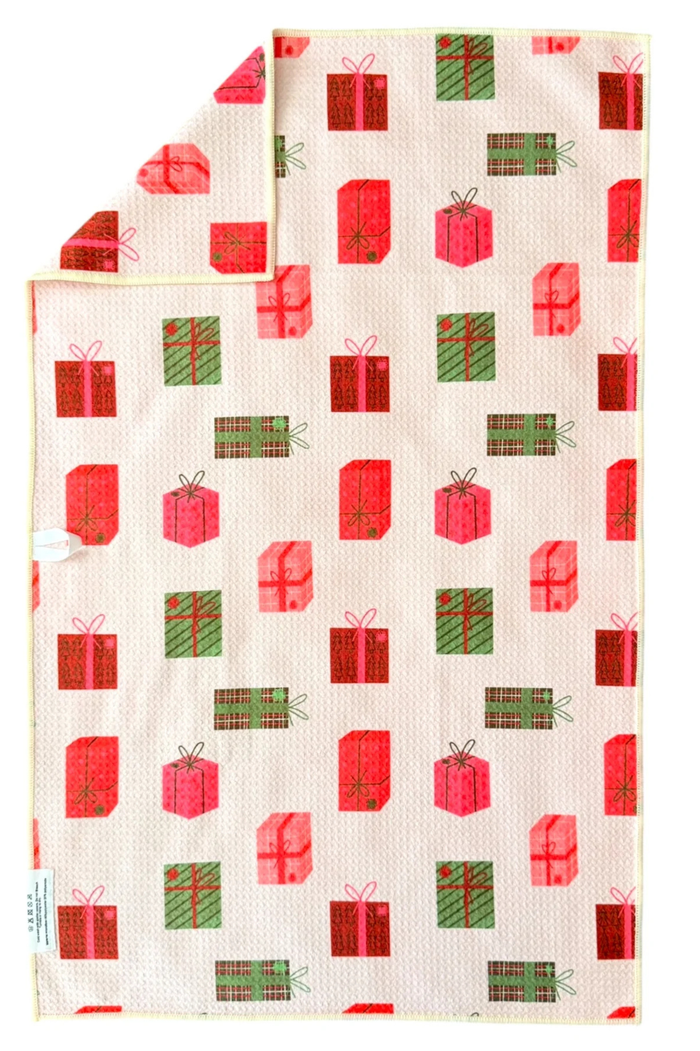 Microfiber hand towel with red and green present pattern.
