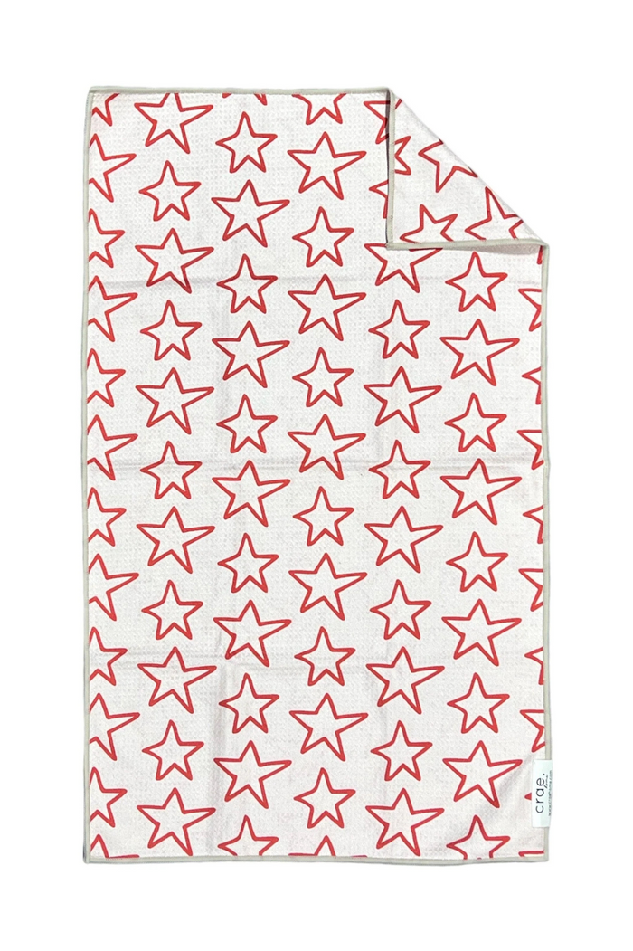 White microfiber towel with red star pattern