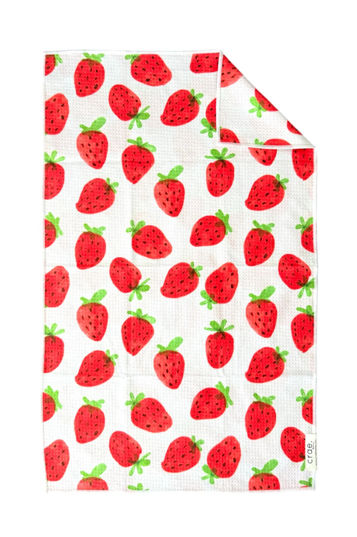 Microfiber hand towel with red strawberry pattern on a white background