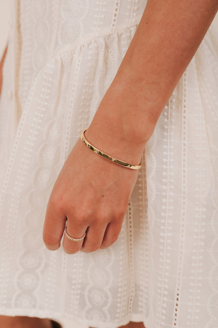 gold cuff bracelet with cubic zirconia triangles