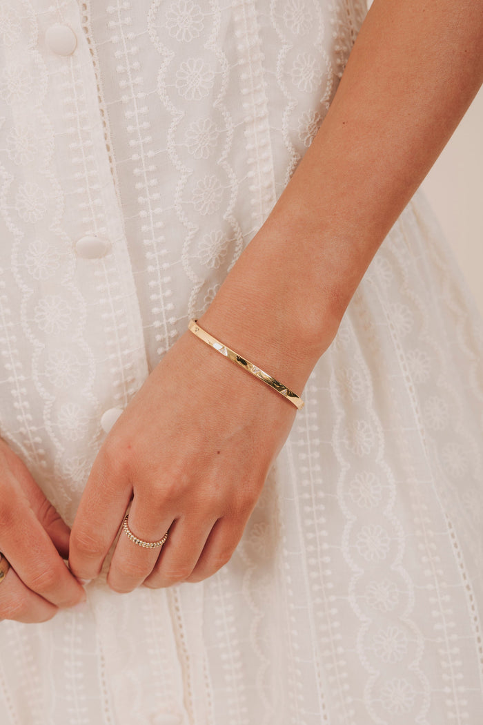 gold cuff bracelet with cubic zirconia triangles