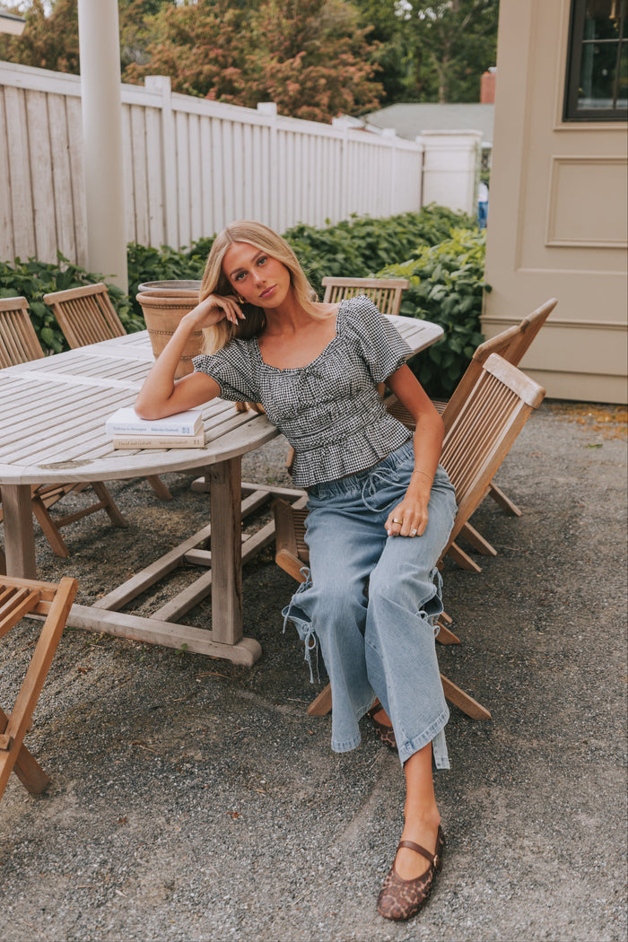 Wide leg jeans with elastic waistband and tied bow detailing. back pockets cute chic