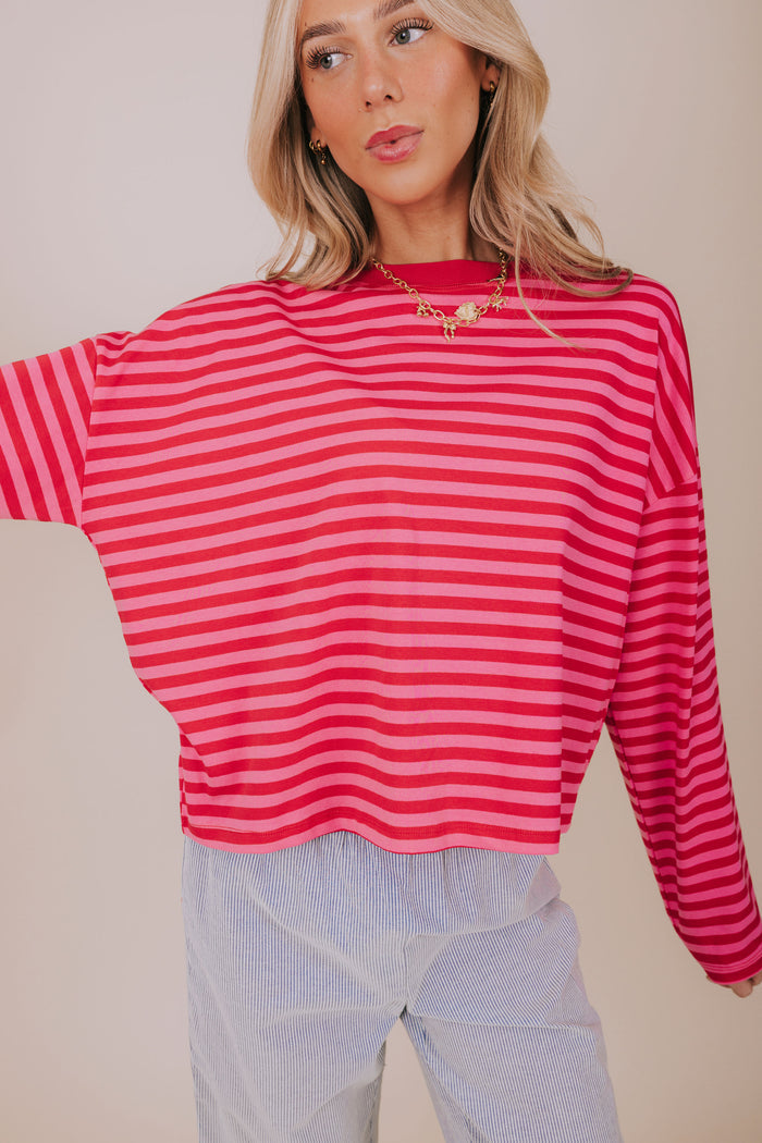 pink and red striped long sleeve close up