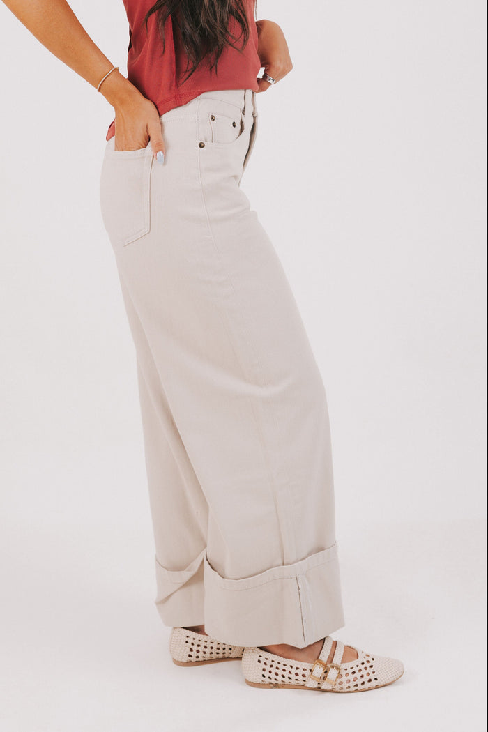beige wide leg jeans with wide cuff side