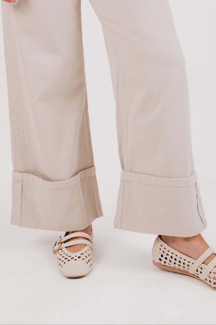 beige wide leg jeans with wide cuff bottom