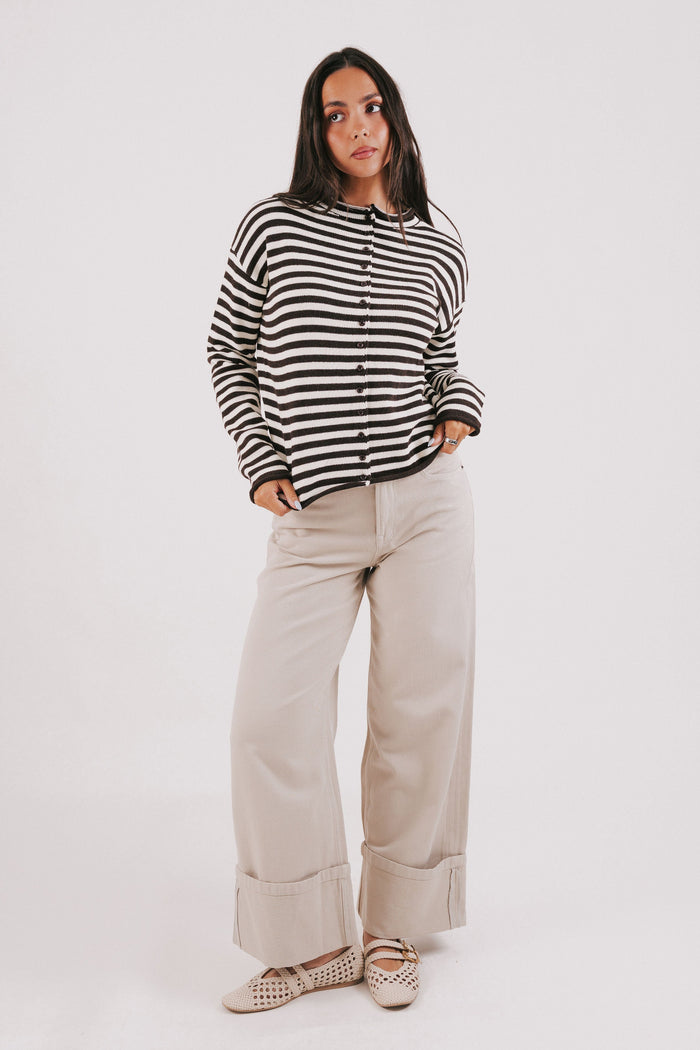 beige wide leg jeans with wide cuff