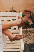 brown woven flats with bow
