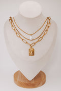 layered necklace set with chain and pearl details