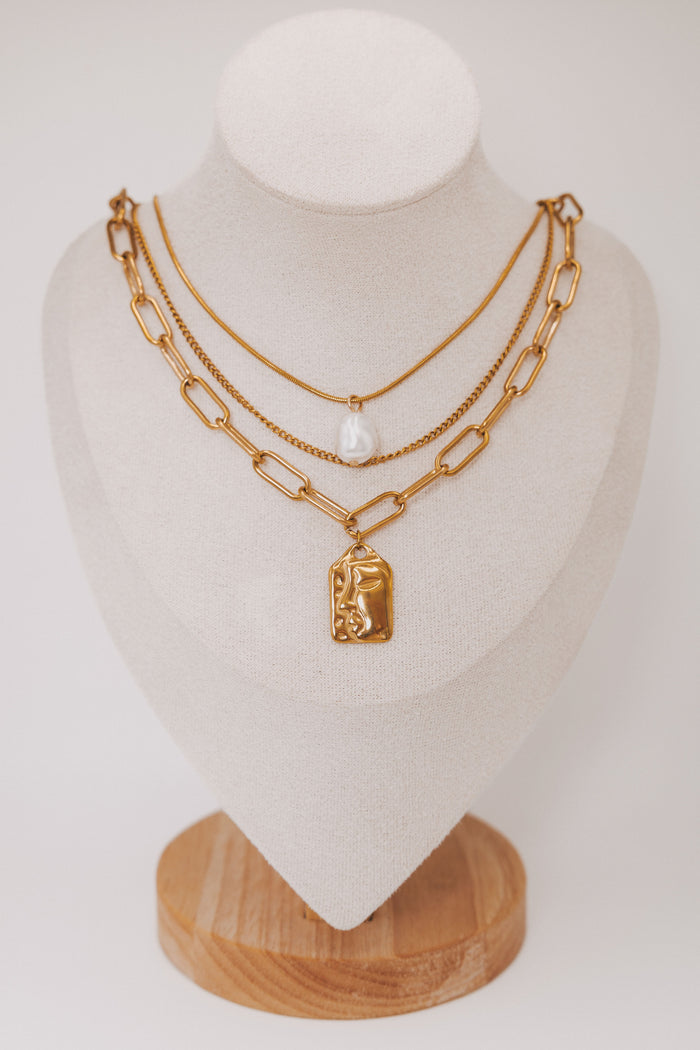 layered necklace set with chain and pearl details