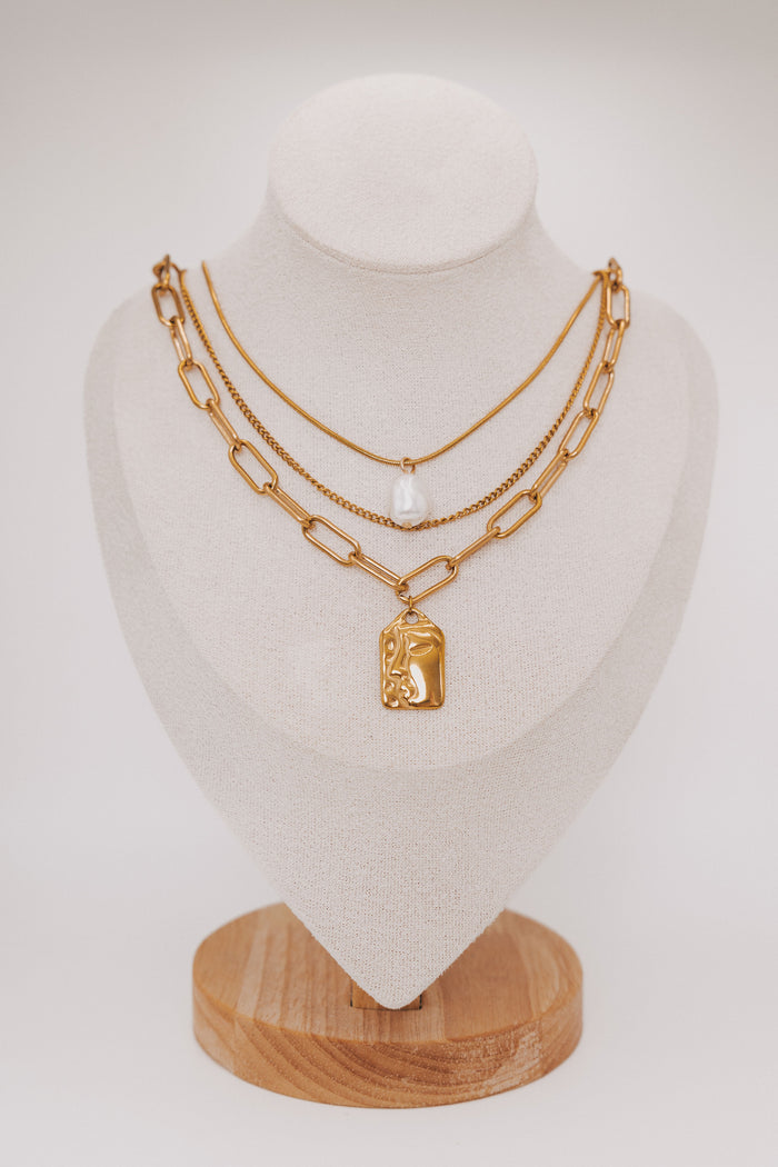 layered necklace set with chain and pearl details