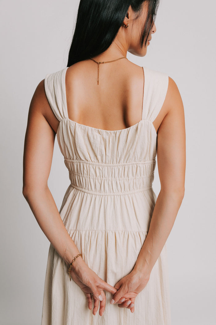 sleeveless cream midi dress with gathered bodice back close