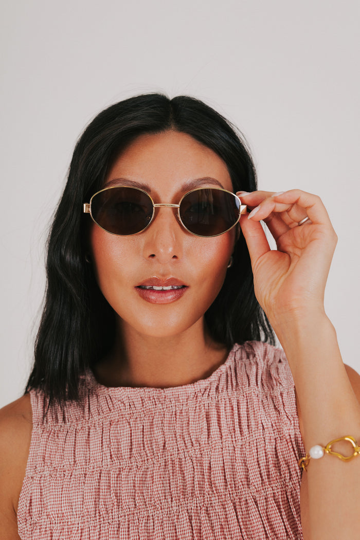 tortoiseshell gold rimmed sunglasses