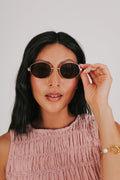tortoiseshell gold rimmed sunglasses