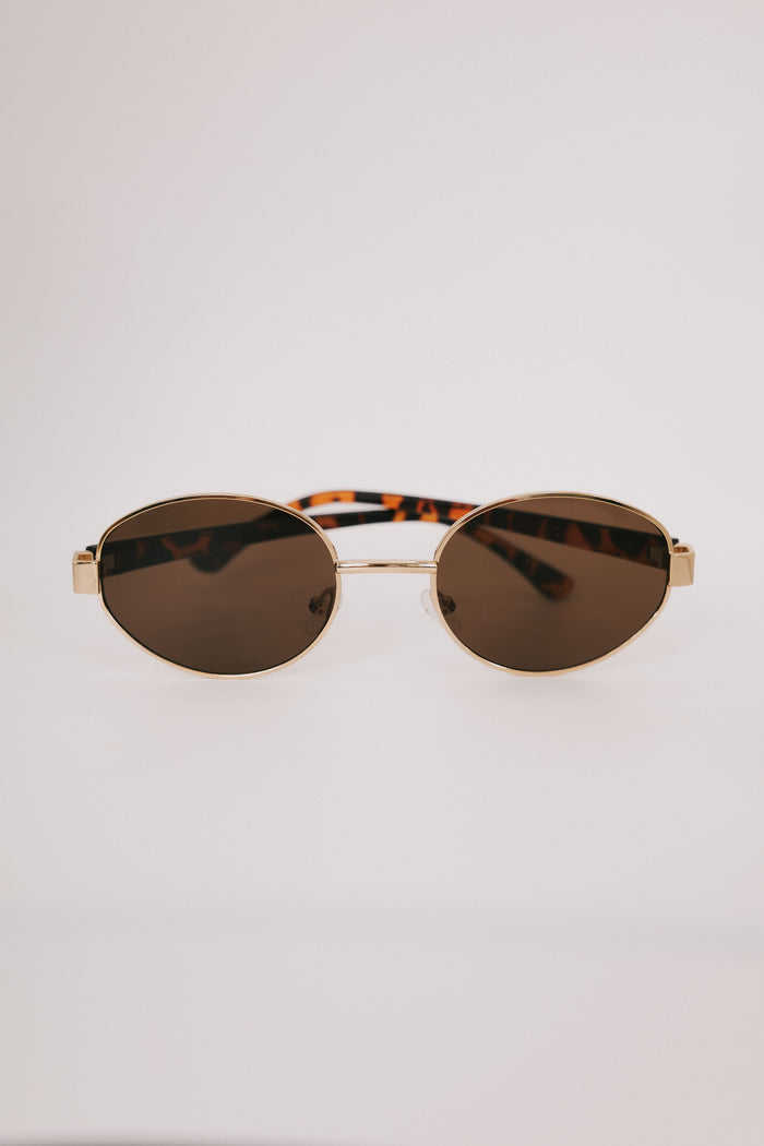 tortoiseshell gold rimmed sunglasses display