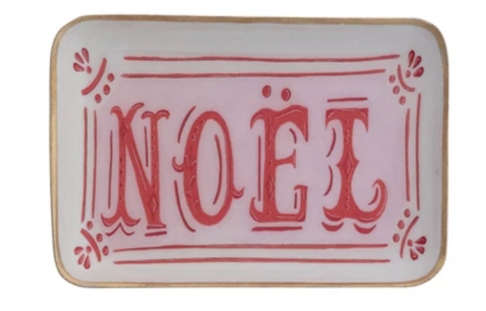 Decorative tray with 'NOEL' in red text on a white background with a gold edge