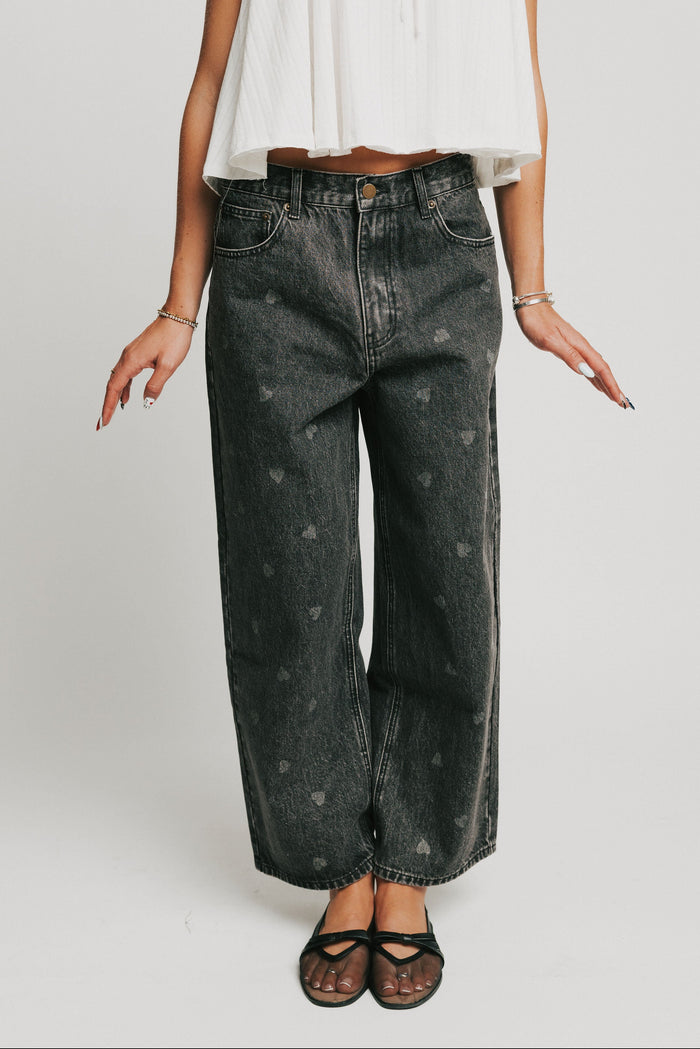 washed black barrel jeans with heart print front