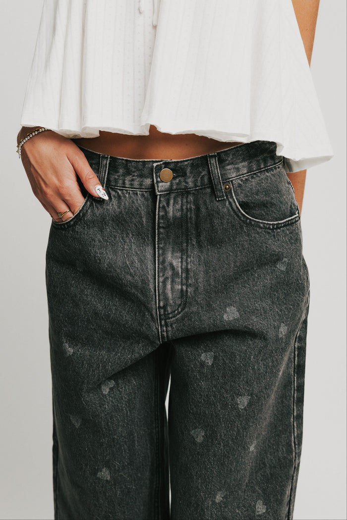 washed black barrel jeans with heart print waistline
