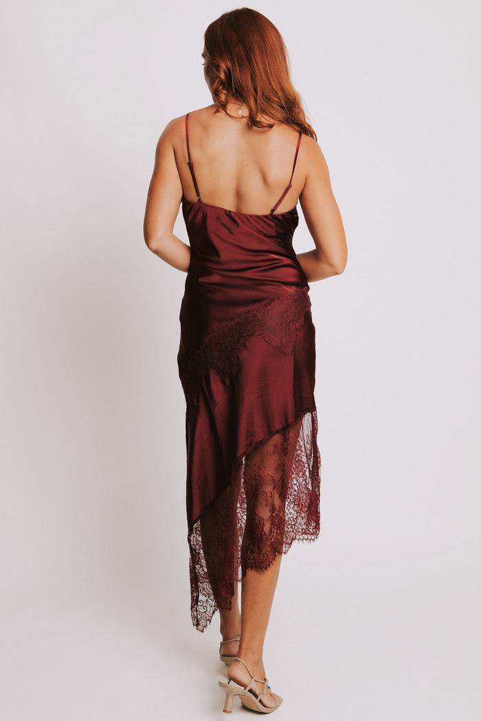 cowl neck dress with lace trimmed asymmetric hemline back