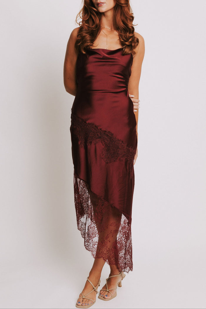 cowl neck dress with lace trimmed asymmetric hemline full
