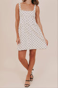 Polka dot buttons basque waist pockets lined mini dress front