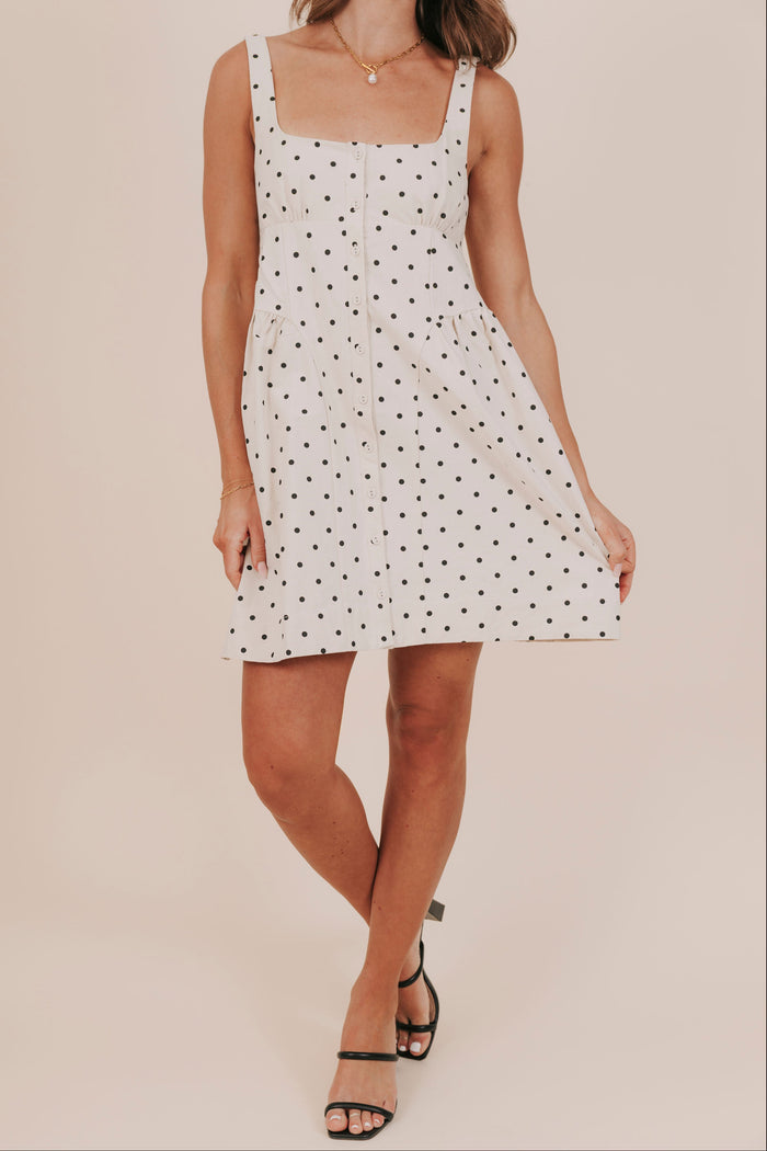 Polka dot buttons basque waist pockets lined mini dress front
