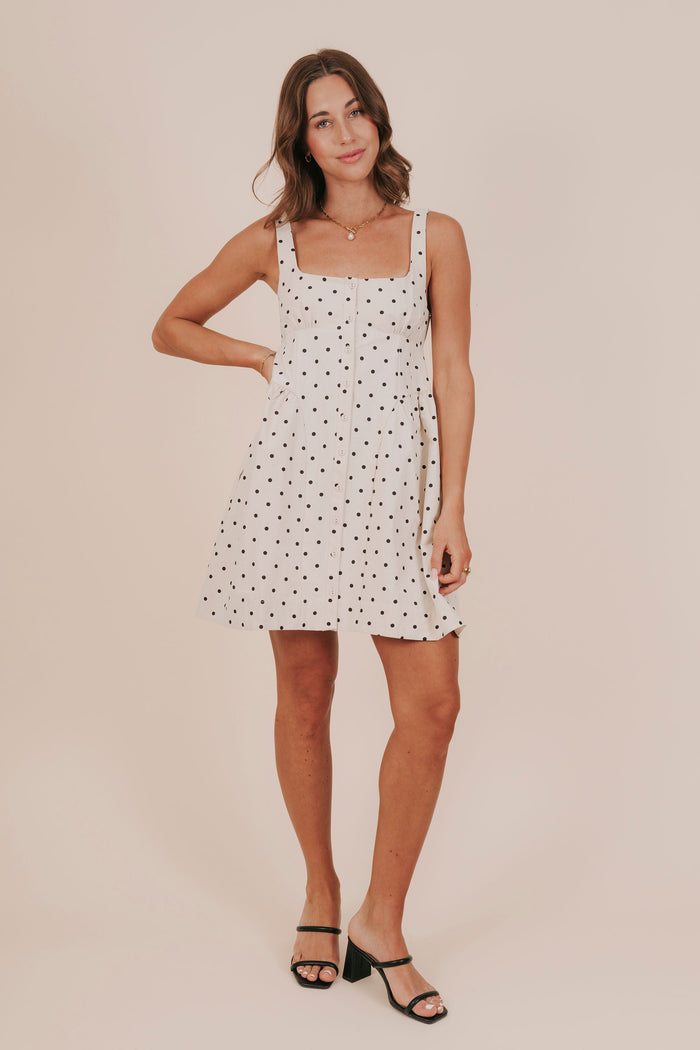 Polka dot buttons basque waist pockets lined mini dress model