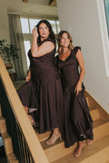 brown satin dress with pink polka dots and cap sleeves