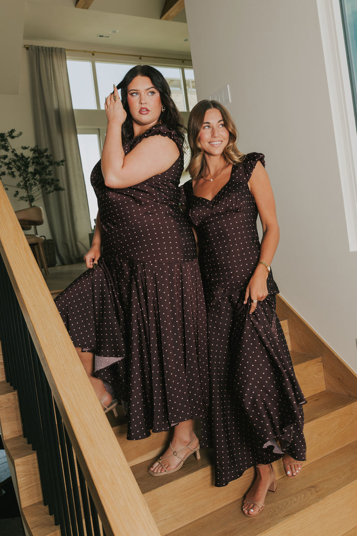 brown satin dress with pink polka dots and cap sleeves