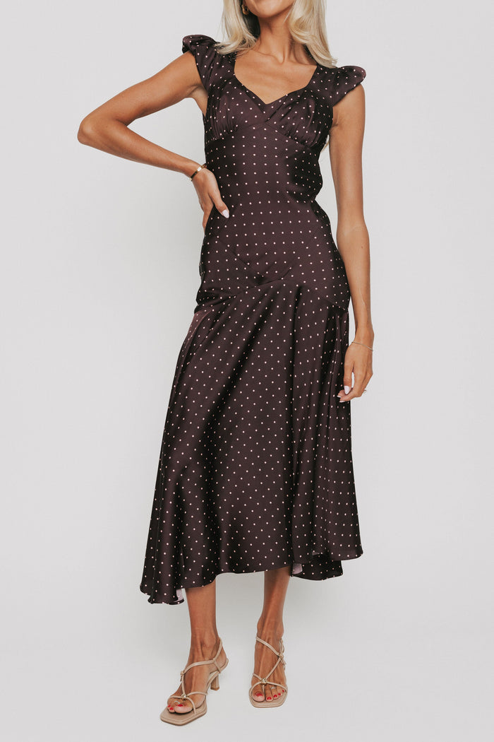 brown satin dress with pink polka dots and cap sleeves