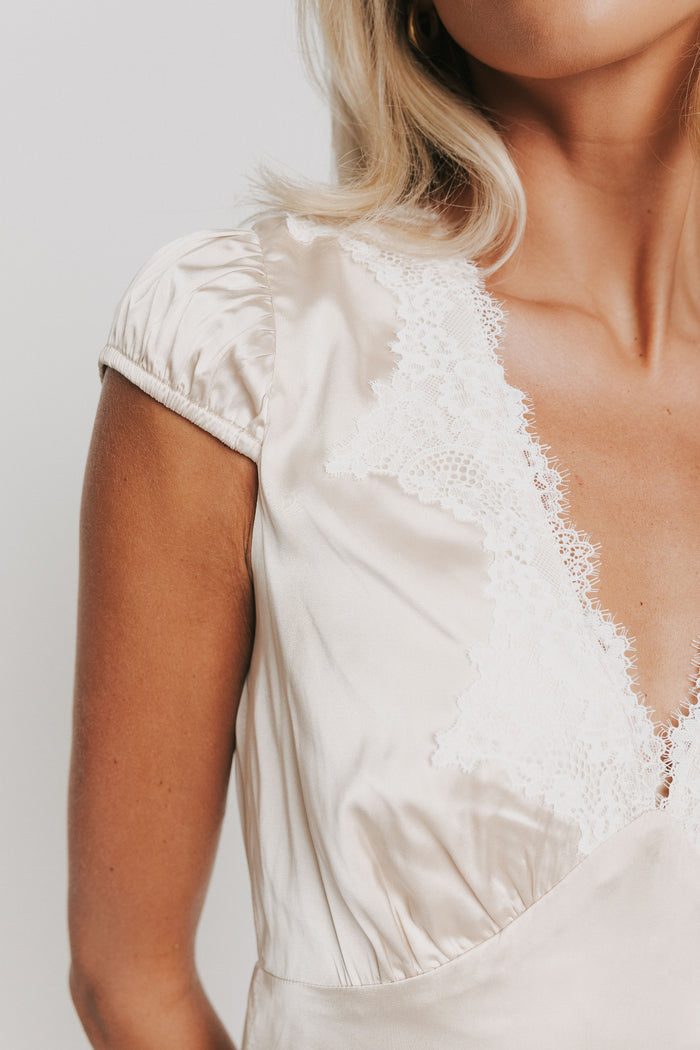 satin midi v neck dress with lace trim on neckline detail