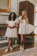 champagne babydoll puff sleeve dress with pearl details lifestyle