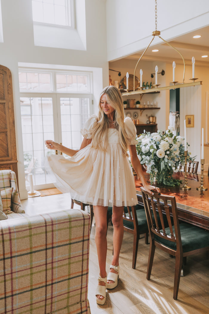 champagne babydoll puff sleeve dress with pearl details lifestyle