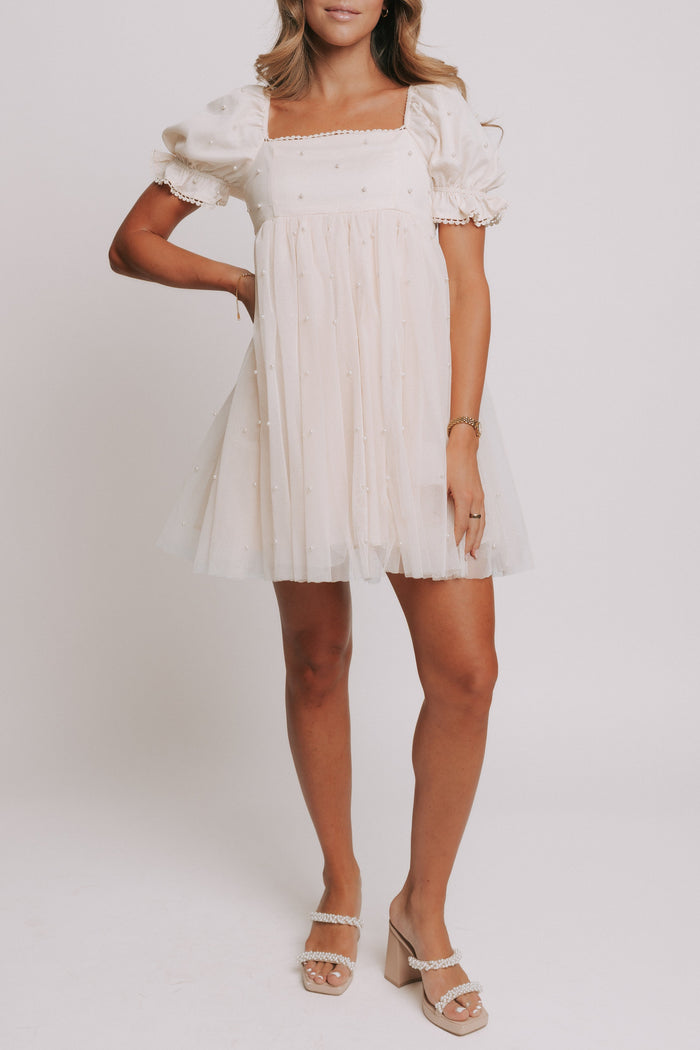 champagne babydoll puff sleeve dress with pearl details