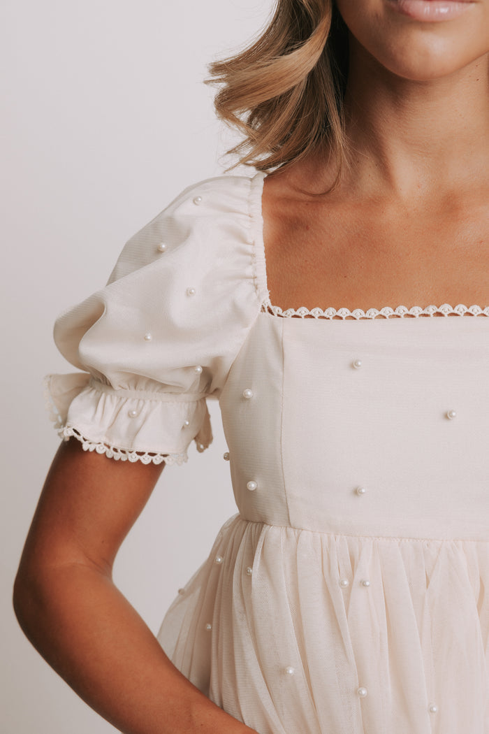 champagne babydoll puff sleeve dress with pearl details neckline