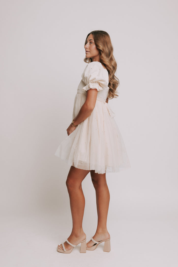 champagne babydoll puff sleeve dress with pearl details side