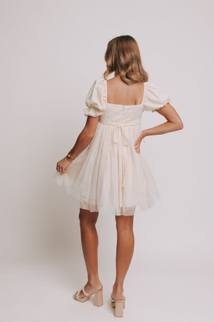 champagne babydoll puff sleeve dress with pearl details back