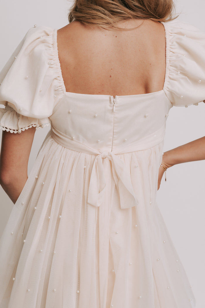 champagne babydoll puff sleeve dress with pearl details back close