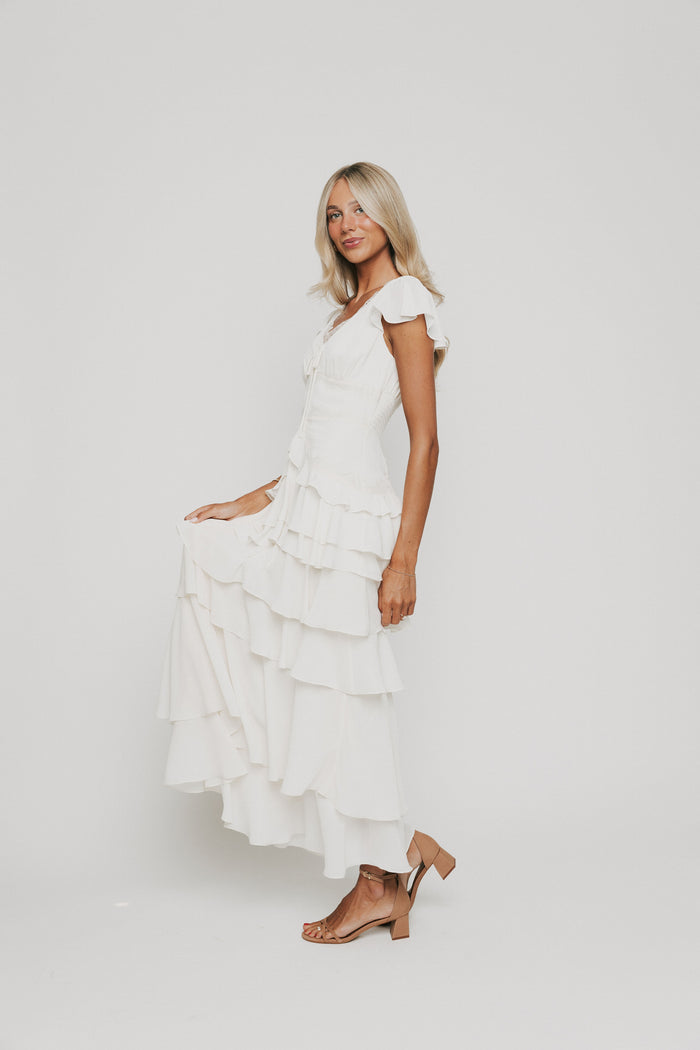 ivory v neck maxi dress with ruffled tiers side