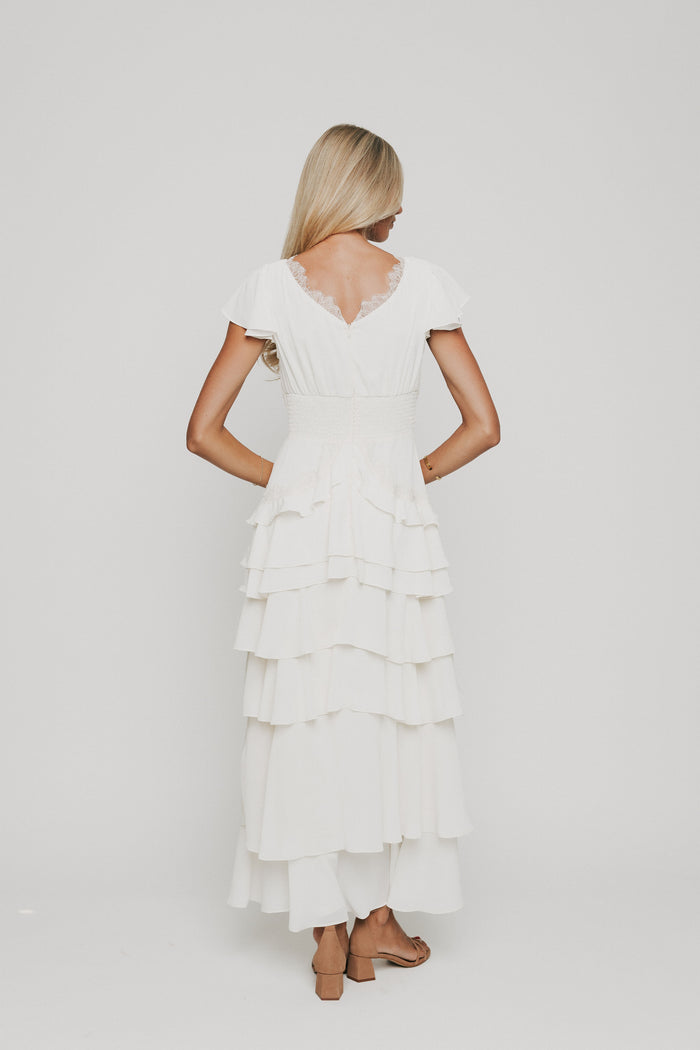 ivory v neck maxi dress with ruffled tiers back