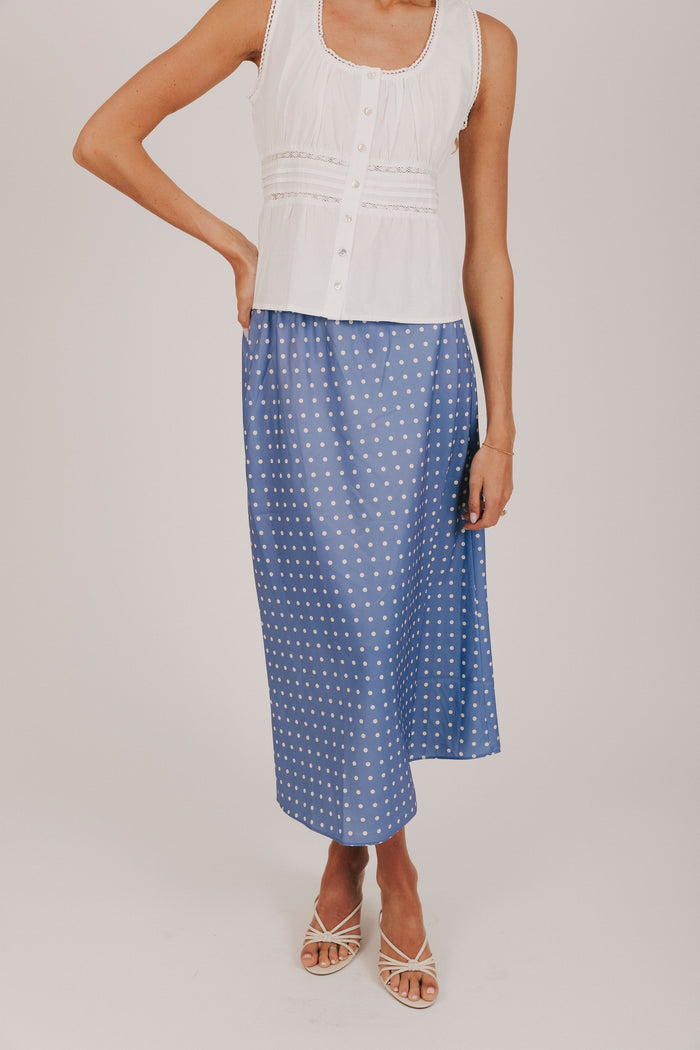 Blue satin skirt with white polka dots and an elastic waistband