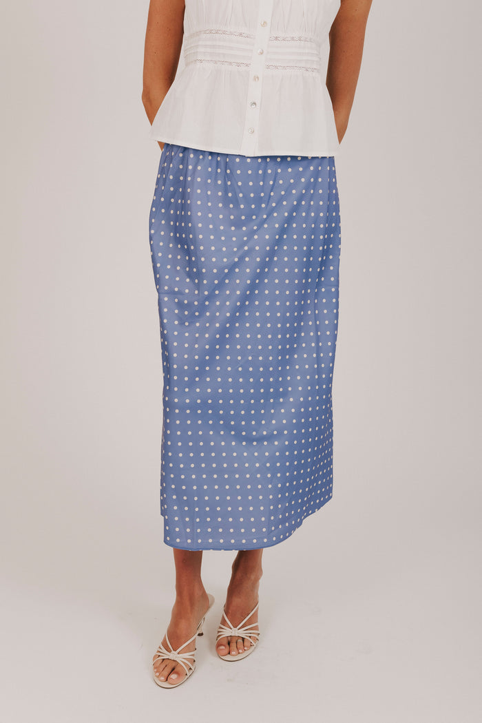 Blue satin skirt with white polka dots and an elastic waistband