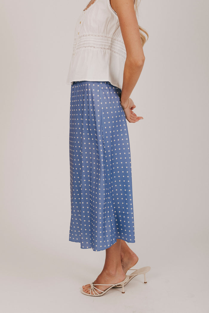 Blue satin skirt with white polka dots and an elastic waistband