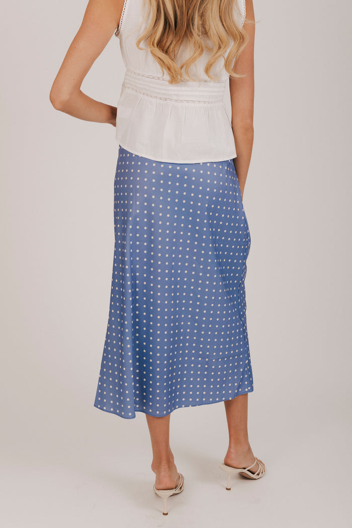 Blue satin skirt with white polka dots and an elastic waistband