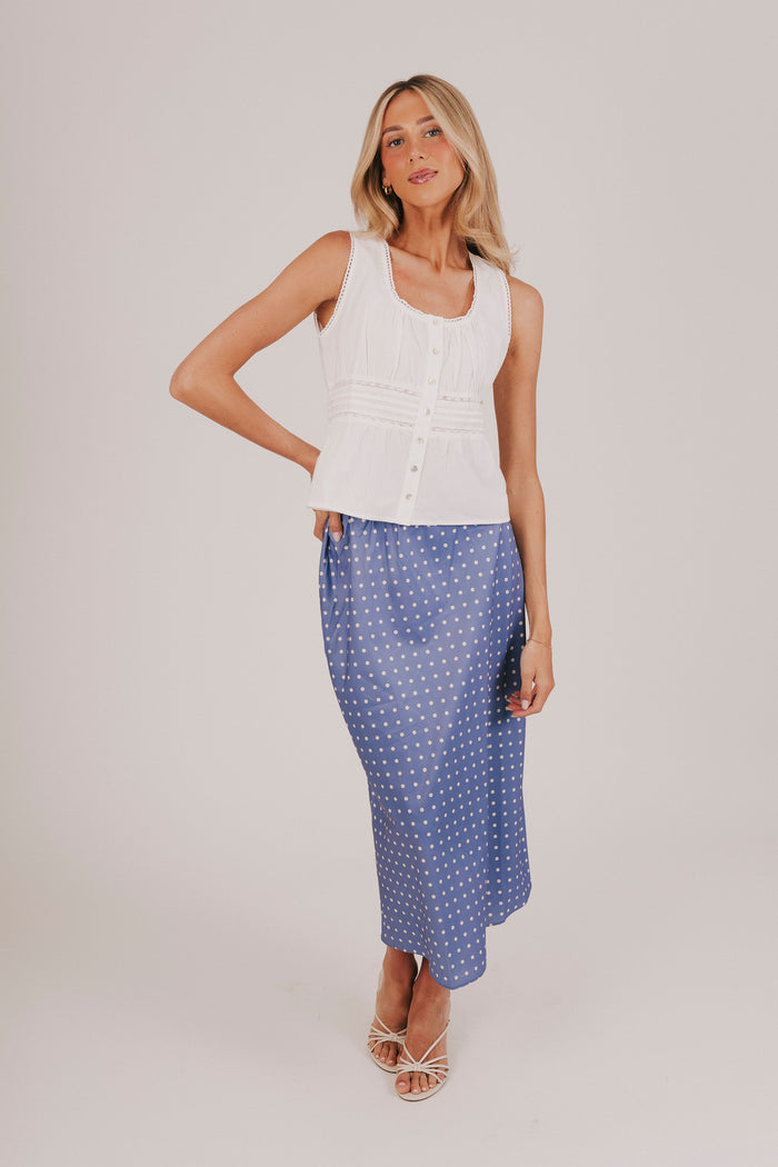 Blue satin skirt with white polka dots and an elastic waistband
