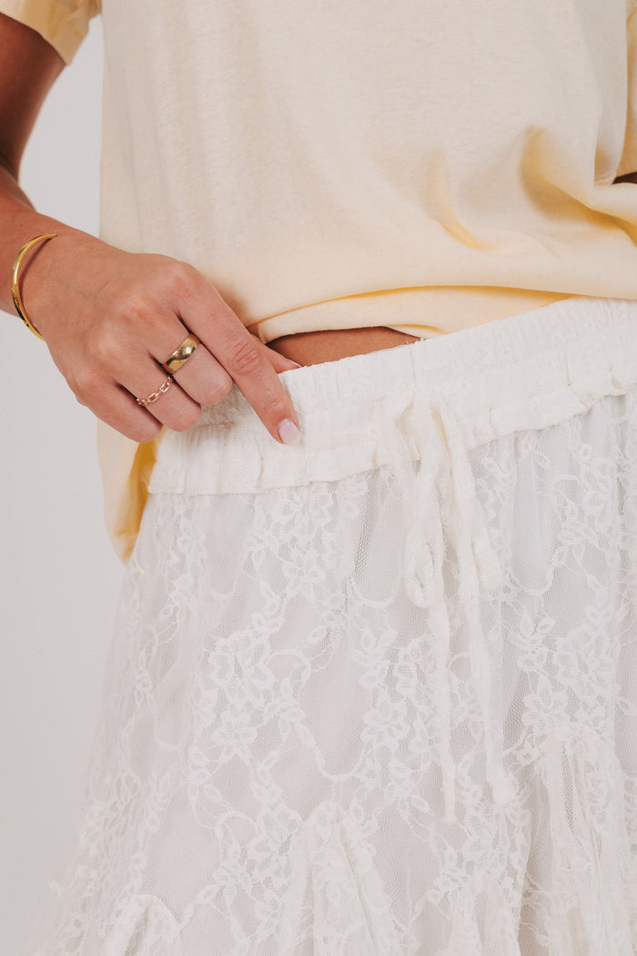 white lace mini skirt with ruffles