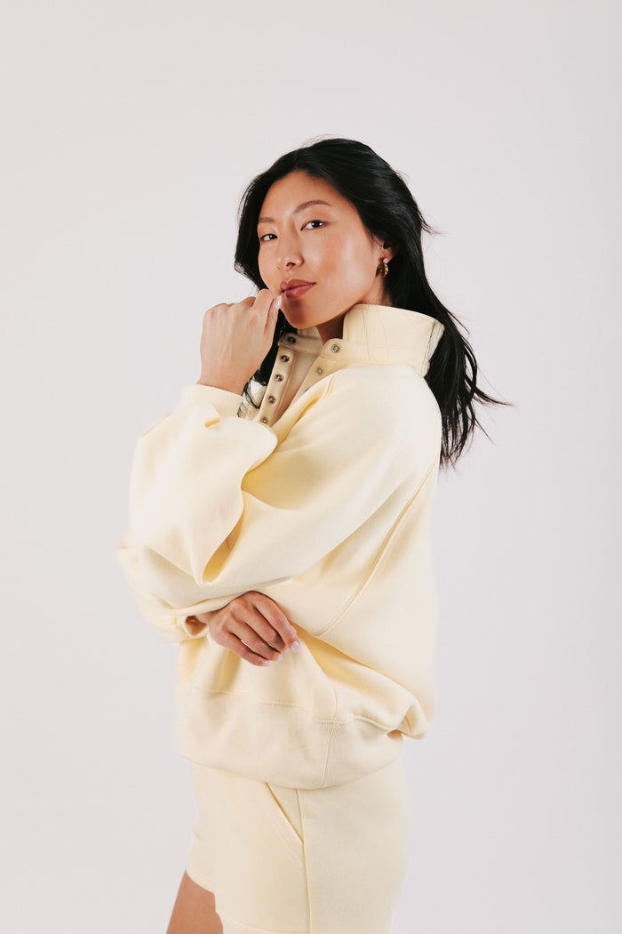 pale yellow partial button down sweatshirt side