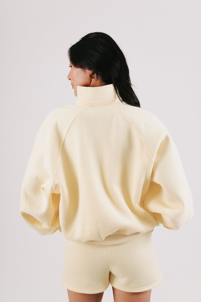 pale yellow partial button down sweatshirt back
