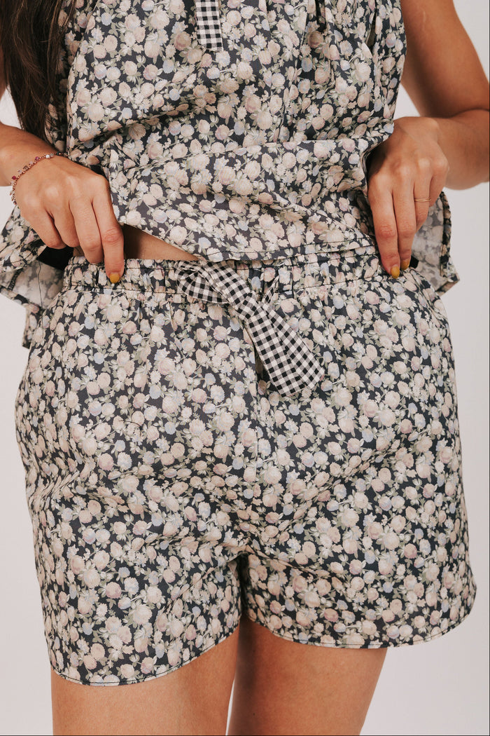 black floral print shorts with bow detail